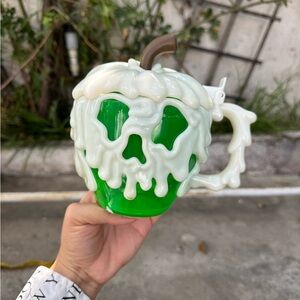 Disney Green Poison Apple Mug with White Drip Design